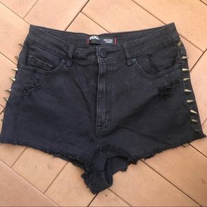 High waisted denim shorts with brass spikes